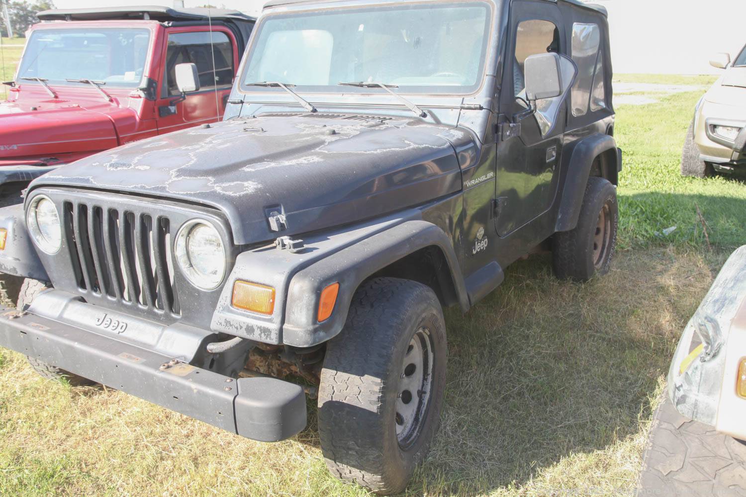 McLemore Auction Company - Auction: Four Classic Jeeps Including a 1990  Custom Wrangler with LS Swap ITEM: 1997 Black Jeep Wrangler  5sp VIN  1J4FY29P5VP521772 - BILL OF SALE ONLY