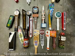 Variety of Beer Taps and Metal Signs