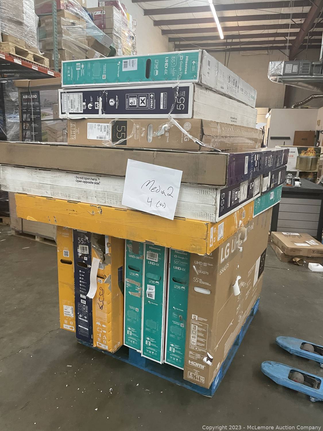 McLemore Auction Company Auction 1000s of Books and Salvage TVs in